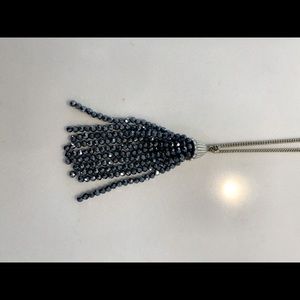 JCrew long gold necklace with dark gray tassel